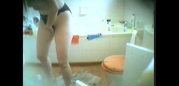  Hot blonde MILF spied naked while toweling off after a bath. Enjoy her big tits!